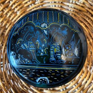 2 Nesting Lacquered Round Trinket Boxes with two figures doing something on them